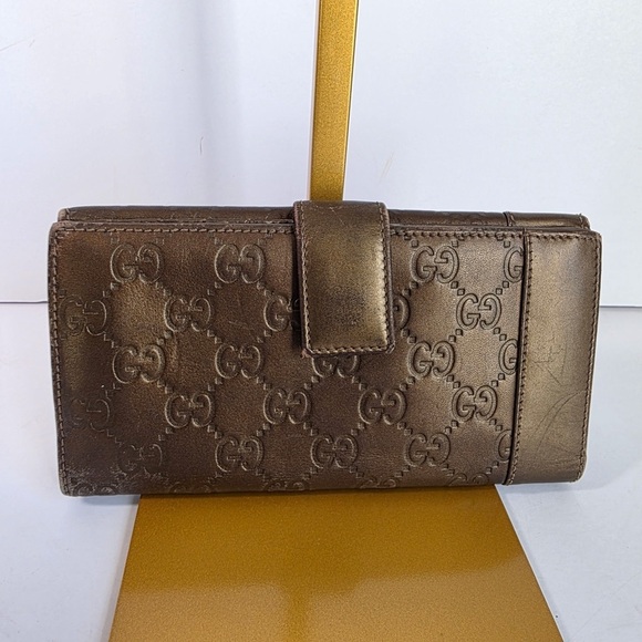 Gucci Handbags - Gucci Embossed Brown Leather Wallet